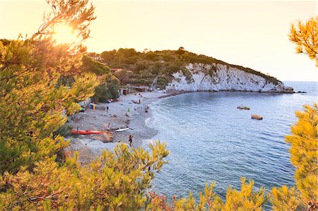 sun bather - Italy, Italia. Tuscany, Toscana Livorno district. Tuscan Archipelago National Park. Elba island. Portoferraio. La Padulella beach. Stock Photo - Rights-Managed, Code: 862-07690138