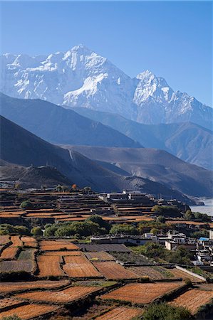 Nepal, Mustang, Kagbeni. The soaring peak of Nilgiri behind the village of Kagbeni. Stock Photo - Rights-Managed, Code: 862-07690467