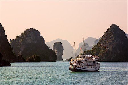 simsearch:862-03437671,k - Vietnam, Quang Ninh Province, Ha Long Bay. A tourist junk cruises among the two thousand limestone Karst islands in Ha Long Bay a spectacular World Heritage Site. Stock Photo - Rights-Managed, Code: 862-07690970