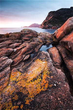 Freycinet National Park, Tasmania, Australia. Sunrise over rocky coast Photographie de stock - Rights-Managed, Code: 862-07909357