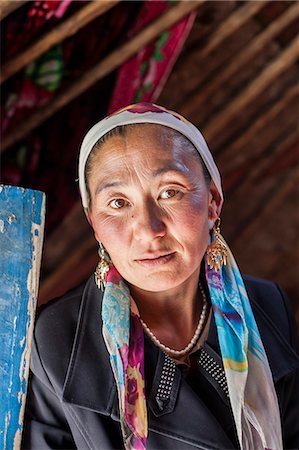 China, Xinjiang, Karakul lake. Kyrgyz woman inside her yurt (MR) Stock Photo - Rights-Managed, Code: 862-07909475