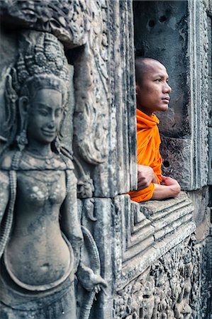 simsearch:862-05997270,k - Cambodia, Siem Reap, Angkor Wat complex. Monk inside Bayon temple (MR) Stock Photo - Rights-Managed, Code: 862-07909516