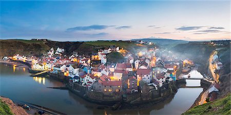United Kingdom, England, North Yorkshire, Staithes. The harbour seen at dusk from Cowbar Nab. Stock Photo - Rights-Managed, Code: 862-07909583
