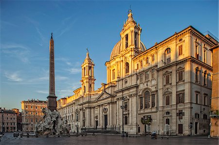 General view at sunrise of Piazza Navona, Sant' Agnese in Agone and the Fountain of the Four Rivers looking south. Stock Photo - Rights-Managed, Code: 862-07910131