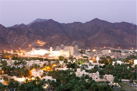 Oman, Bahla. The city and the fortress from elevated point of view at dusk Stock Photo - Rights-Managed, Code: 862-07910359