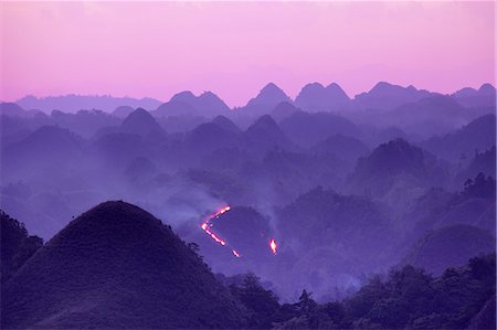 Asia, South East Asia, Philippines, Visayas, Bohol, a forest fire on the chocolate hills Photographie de stock - Rights-Managed, Code: 862-07910398