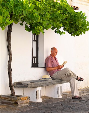 simsearch:862-07910476,k - Portugal, Alentejo, Monsaraz, Man sitting under tree(MR) Stock Photo - Rights-Managed, Code: 862-07910494