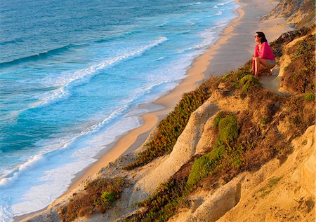 simsearch:862-07910469,k - Portugal, Estramadura, Santa Cruz, woman sitting at lookout (MR) Stock Photo - Rights-Managed, Code: 862-07910518