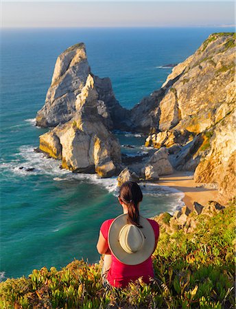 simsearch:862-07910527,k - Portugal, Estramadura, Ursa woman sitting on cliff edge (MR) Stock Photo - Rights-Managed, Code: 862-07910527