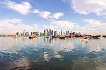 doha skyline - Qatar, Doha. Cityscape with fishing boats in the foreground Stock Photo - Rights-Managed, Code: 862-07910655