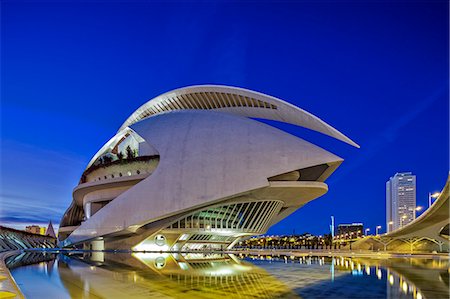 Twilight view of the El Palau de les Arts Reina Sofia, Opera House, and the Pont de Montolivet Bridge located in the City of Arts and Sciences, Ciutata de les Arts i les Ciencies, Valencia, Spain. Stock Photo - Rights-Managed, Code: 862-07910733