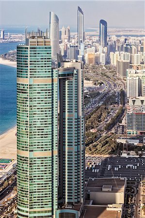 simsearch:862-07910882,k - View from above looking down the Abu Dhabi Corniche with The Nation Towers, The Domain Tower, The Landmark and the Trust Tower in the distance, Al Marina Abu Dhabi, The UNited Arab Emirates. Stock Photo - Rights-Managed, Code: 862-07910876