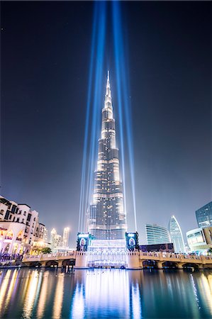 United Arab Emirates, Dubai. Burj Khalifa at dusk, with light show Stock Photo - Rights-Managed, Code: 862-07910902