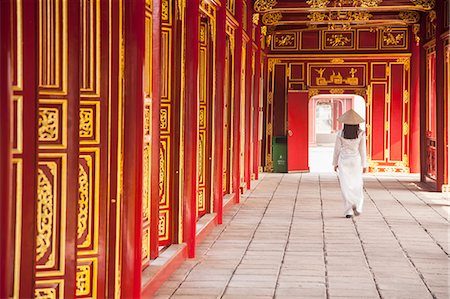 Woman wearing Ao Dai dress in Imperial Palace inside Citadel, Hue, Thua Thien-Hue, Vietnam (MR) Stock Photo - Rights-Managed, Code: 862-07911055