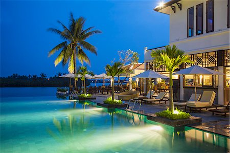 simsearch:862-08273264,k - Swimming pool at Hoi An Beach Resort, Cua Dai beach, Hoi An, Quang Ham, Vietnam Stock Photo - Rights-Managed, Code: 862-07911096