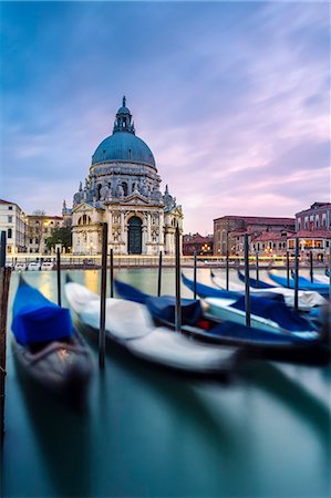 simsearch:862-08090554,k - Italy, Veneto, Venice. Santa Maria della Salute church on the Grand Canal, at sunset Stock Photo - Rights-Managed, Code: 862-08090394