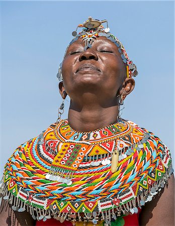 Kenya, Marsabit County, Kalacha. An El Molo girl enjoys a dance at the annual Kalacha Festival. The El Molo live on the shores of Lake Turkana and are the smallest tribe in Kenya. Stock Photo - Rights-Managed, Code: 862-08090887