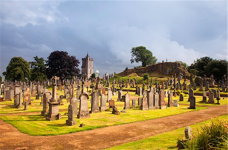 dramatic - UK, Scotland, Stirling. A cemetery on top of a cliff overlooking the town. Stock Photo - Rights-Managed, Code: 862-08091039