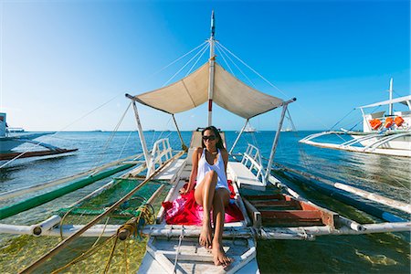 South East Asia, Philippines, The Visayas, Cebu, Malapascua island, girl aboard a catamaran, Bounty beach (MR) Foto de stock - Direito Controlado, Número: 862-08091030