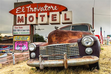 route 66 sign - Old rusted Pontiac car and vintage motel sign behind along the historic U.S. Route 66, Kingman, Arizona, USA Stock Photo - Rights-Managed, Code: 862-08091441