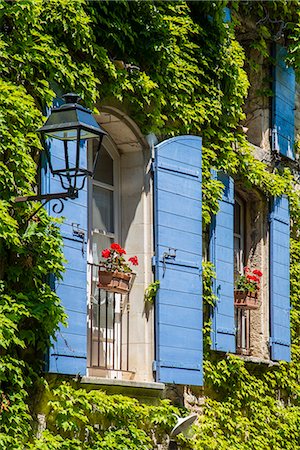 french country home exterior pictures - Ivy surrounded house windows in Provence, France Stock Photo - Rights-Managed, Code: 862-08273097