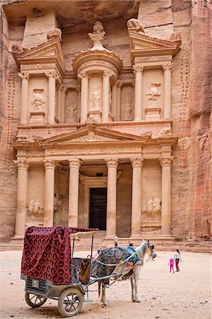 simsearch:862-08273501,k - Jordan, Petra. The most outstanding monument in the ancient Nabataean city of Petra is Al Khazeneh, popularly known as The Treasury. It was hewn into a cliff face of pink sandstone in the first century AD as a king s tomb. Stock Photo - Rights-Managed, Code: 862-08273512