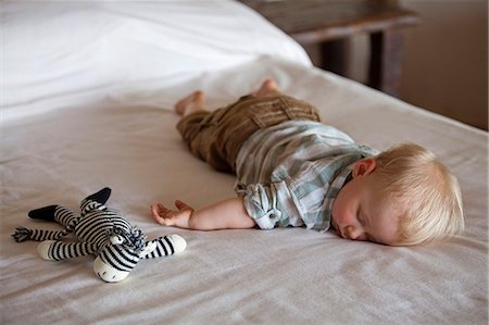 simsearch:862-08273621,k - Kenya, Meru National Park. A young guest, exhausted after his first safari. Stock Photo - Rights-Managed, Code: 862-08273541