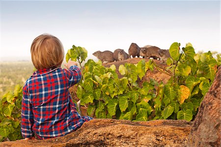 simsearch:862-08273561,k - Kenya, Meru. A young boy spots rock dassies in his pyjamas early in the morning. Stock Photo - Rights-Managed, Code: 862-08273571