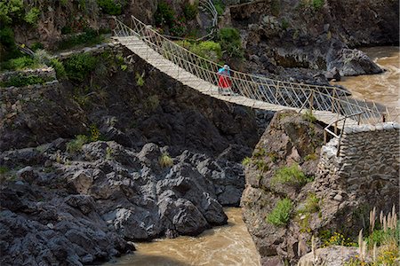 south american indian - South America, Peru, Colca Canyon, native woman walking over inca bridge Stock Photo - Rights-Managed, Code: 862-08273765