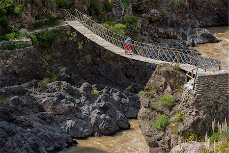 South America, Peru, Colca Canyon, native woman walking over inca bridge Stock Photo - Rights-Managed, Code: 862-08273765