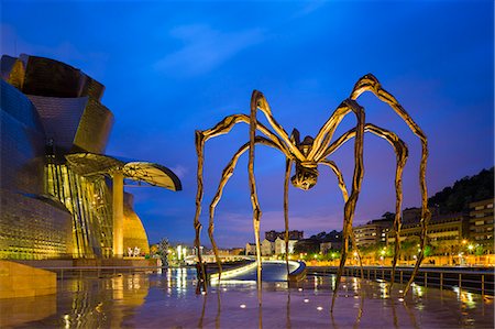 spain not people - Spain, Biscay, Bilbao. The exterior of the Frank Gehry designed Guggenheim Museum with The Marman sculpture by Louise Bourgeois. Photographie de stock - Rights-Managed, Code: 862-08273811