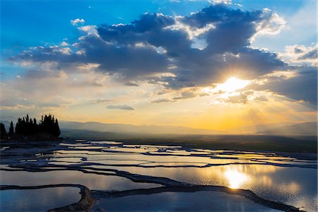 puesta del sol - Turkey, Western Anatolia, Pamukkale, UNESCO site,  white travertine basins Foto de stock - Con derechos protegidos, Código: 862-08273948