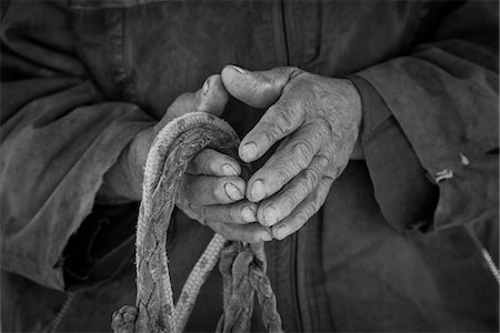 South America, Patagonia, Chile, Magallanes y la Antartica, Tierra del Fuego, close up of a Gauchos hands Photographie de stock - Rights-Managed, Code: 862-08698769