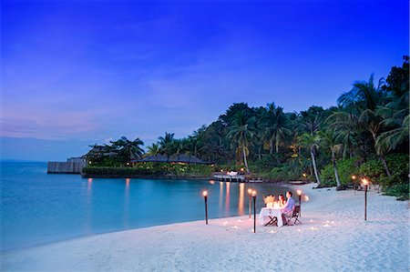 dinner on the beach - Asia, Cambodia, Sihanoukville, Preah Sihanouk, Koh Rong, Song Saa island resort, young couple having a private dinner in the evening; MR, PR Stock Photo - Rights-Managed, Code: 862-08698968
