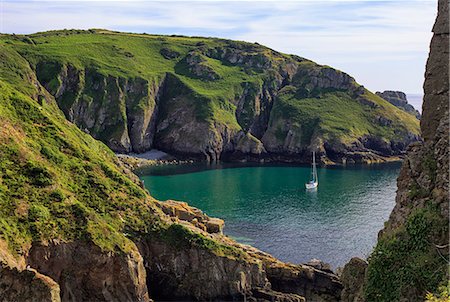 sailing - UK, Channel Islands, Sark. Yacht moored in a bay off the rugged west coast of Sark Island. Stock Photo - Rights-Managed, Code: 862-08699058