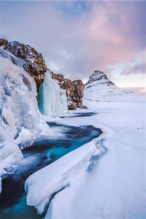 snaefellsnes peninsula - Snaefellsness peninsula, Western Iceland, Europe. Frozen Kirkjufellfoss waterfall in winter with Kirkjufell mountain in the backdrop. Photographie de stock - Rights-Managed, Code: 862-08699320