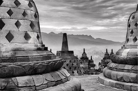 Asia, Indonesia, Java, Yogyakarta, Magelang, Borobudur, or Barabudur, a 9th-century Mahayana Buddhist Temple and UNESCO World Heritage Site, giant bells each containing a Buddha Stock Photo - Rights-Managed, Code: 862-08699341