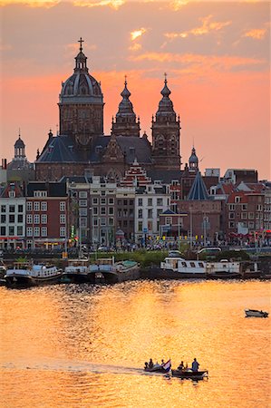 dutch history - Netherlands, North Holland, Amsterdam. City skyline at sunset with domes of Basilica of Saint Nicholas. Stock Photo - Rights-Managed, Code: 862-08699687