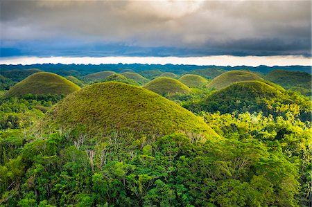 simsearch:862-08699699,k - Chocolate Hills in late afternoon, Carmen, Bohol, Central Visayas, Philippines Fotografie stock - Rights-Managed, Codice: 862-08699699