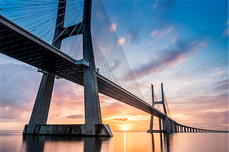 Lisbon, Portugal. Vasco Da Gama bridge at sunrise, the longest bridge in Europe. Stock Photo - Rights-Managed, Code: 862-08699709