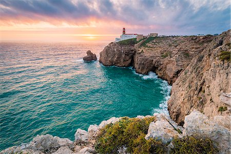 sagres - Cabo de Sao Vicente (Cape St. Vincent) , Sagres, Algarve, Portugal. The southwesternmost lighthouse in Europe at sunset. Stock Photo - Rights-Managed, Code: 862-08699719