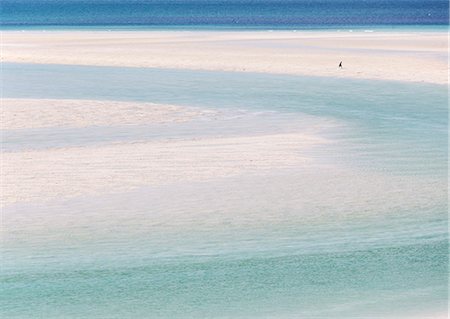 Scotland, Western Isles, Isle of Harris. A person walking on Luskentyre beach in the Outer Hebrides. Stock Photo - Rights-Managed, Code: 862-08699997