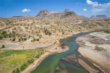 farm water rocks - Ethiopia, Amhara Region, Welo.  The 608km-long Tekeze River rises in the central Ethiopian Highlands and flows west, north and then west again until it joins a tributary of the Nile in Sudan. Stock Photo - Rights-Managed, Code: 862-08718766