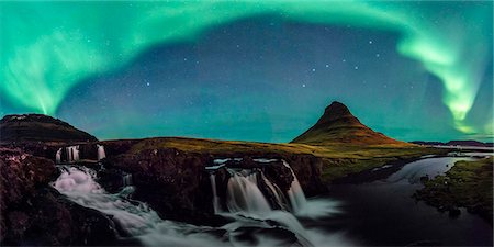 panorama night - Grundafjordur, Snaefellsness peninsula, Western Iceland. Panoramic view of the northern lights above the Kirkjufell mountain and Kirkjufellfoss waterfall. Stock Photo - Rights-Managed, Code: 862-08718969