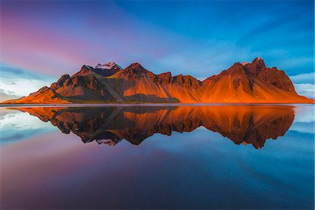 Stokksnes, Iceland. Vestrahorn mountain mirrors in the waters of the Stokksnes bay. Stock Photo - Rights-Managed, Code: 862-08718974