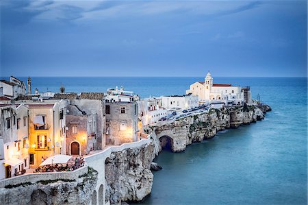 Italy, Italia. Apulia, Puglia, Foggia district. Gargano, Vieste. Old town and Punta di San Francesco. (San Francesco promanade) Stock Photo - Rights-Managed, Code: 862-08719098