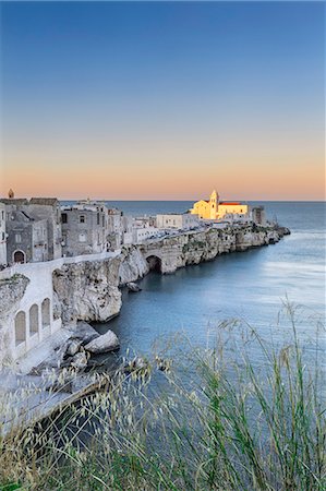 Italy, Italia. Apulia, Puglia, Foggia district. Gargano, Vieste. Old town and Punta di San Francesco. (San Francesco promanade) Stock Photo - Rights-Managed, Code: 862-08719091