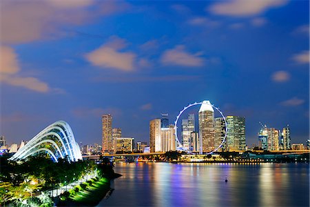 singapore skyline - South East Asia, Singapore, Gardens by the Bay cloud forest and city backdrop of Marina Bay, Singapore Flyer ferris wheel Stock Photo - Rights-Managed, Code: 862-08719497