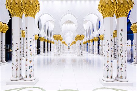 United Arab Emirates, Abu Dhabi. The beautiful date palm-styled column capitals of Sheikh Zayed Grand Mosque. Completed in 2007 the mosque comprises 1096 of these arcade columns. Stock Photo - Rights-Managed, Code: 862-08719905