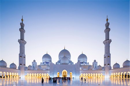 simsearch:862-03360413,k - United Arab Emirates, Abu Dhabi. The courtyard and white marble exterior of Sheikh Zayed Grand Mosque.  The spectacular evening lighting varies from white to blue according to the phases of the moon. Stock Photo - Rights-Managed, Code: 862-08719902